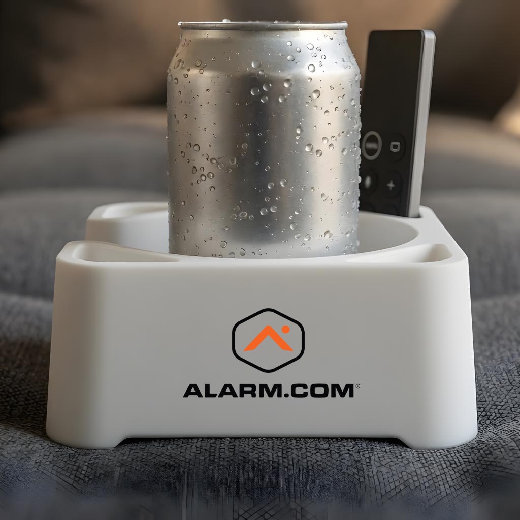 Light MugBrick with an Alarm.com logo holding a can and a remote